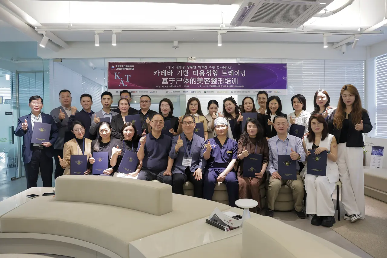Group photo of visiting doctors and the Pascal team after the cadaver-based aesthetic surgery training