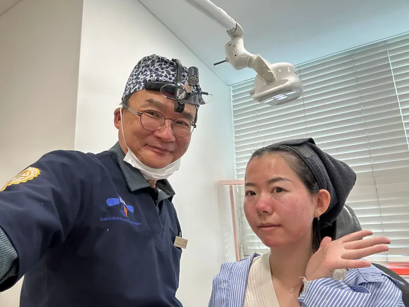 Dr. Kang taking a photo with a patient in a Pascal Clinic exam room, photo 5