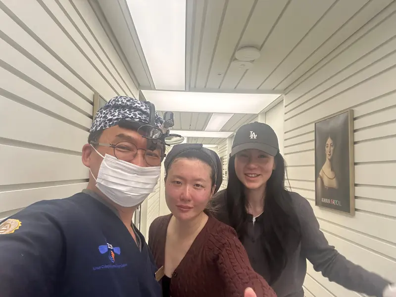 Dr. Kang taking a photo with a patient in a Pascal Clinic exam room, photo 8