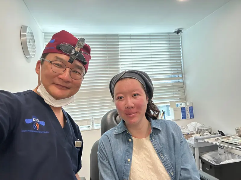 Dr. Kang taking a photo with a patient in a Pascal Clinic exam room, photo 11