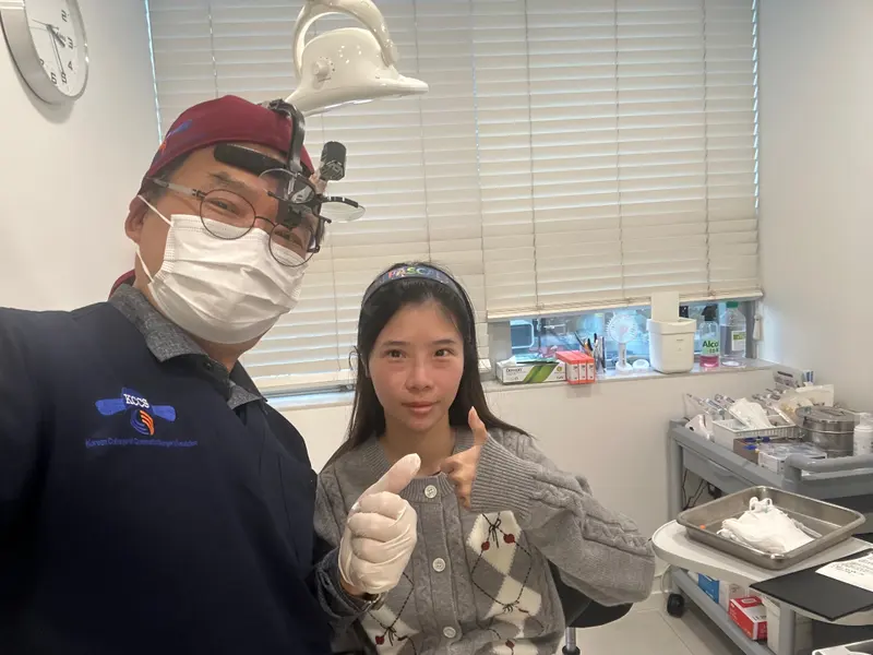 Dr. Kang taking a photo with a patient in a Pascal Clinic exam room, photo 22