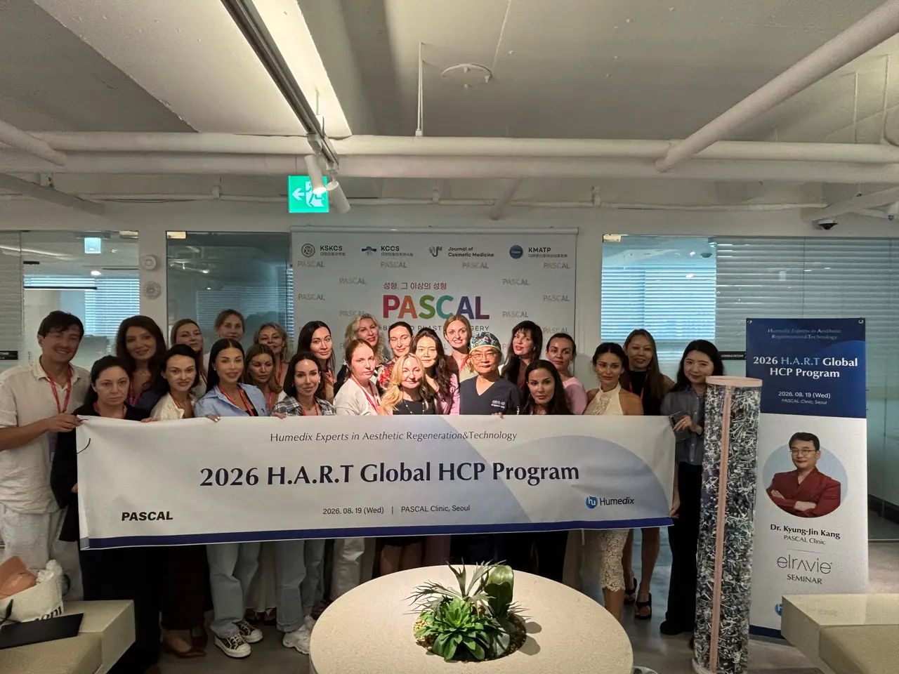 Group photo of the 2026 H.A.R.T Global HCP Program at Pascal Clinic with a banner and 25 visiting dermatologists